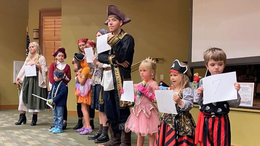 Children and adults dressed as pirates for the costume contest at Fairhope Public Library's PirateCon 2025.