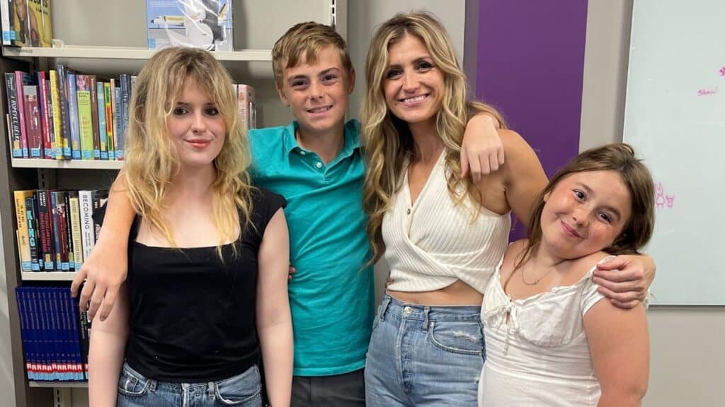 Jada Pryor and her three kids Jubilee, Lazarus, and Gloryana smiling at the Fairhope Public Library